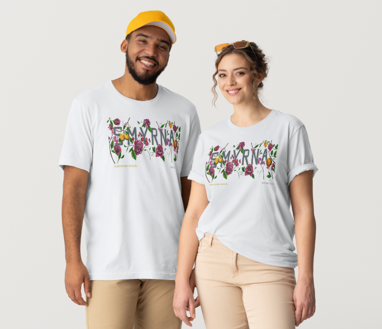 Two people wearing the Downtown Social shirt, printed across the chest with the word Smyrna drawn in roses and greenery